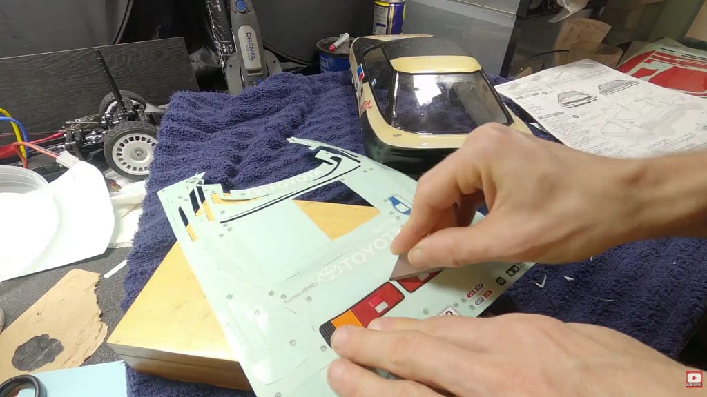 Cutting a tail light decal from the decal sheet before applying it to the Tamiya TT-02 Celica ST165 body