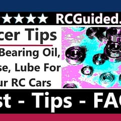 Various bottles and containers of lubricants and oils for RC cars, including bearing oils and greases, displayed on a table.