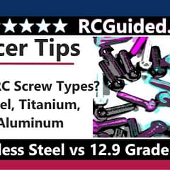 Close-up view of various RC screws including steel, titanium, and aluminum types arranged side by side on a dark surface. Each screw type showcases its unique characteristics and finish, highlighting the differences in material composition and design.