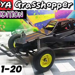 Tamiya Grasshopper Black Edition RC buggy chassis after steps 1-20 assembly, unpainted black body, on the work bench